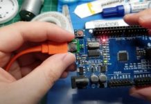 Image of a person working with Arduino board